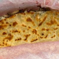 Quesadilla · Large corn tortilla stuffed with  mozzarella cheese and your choice of meat.