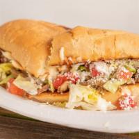 Torta · Mexican sandwich filled with refried beans, cheese, lettuce, sour cream and your choice of m...