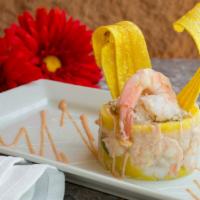 Causa De Camaron · Layers of lemony yellow mashed potato, stuffed with shrimp and pink sauce.