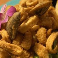 Jalea Mixta · Go peruvian style and try a deep fried seafood mix of calamari, fish and shrimp served with ...