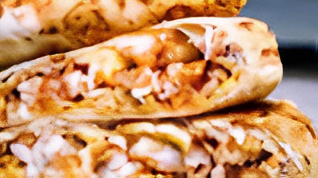 Bbq Chicken Quesadilla · One large flour tortilla, stuffed with grilled chicken, cheese, BBQ sauce, crispy onions, and green sauce.