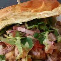 Pollo Saltado · Comes with fries it's a chicken sandwich with cooked onions and tomatoes with cilantro and p...