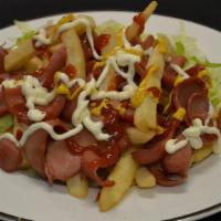 Salchipapas · French fries mixed with hot dogs.