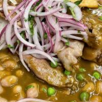 Seco De Cordero · Braised lamb shank in cilantro sauce, served with pinto beans stew, steamed rice and steamed...
