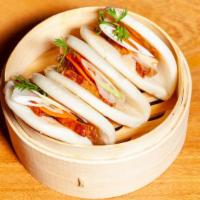 Bbq Pork Bao Buns · Three Chinese BBQ pork, daikon radish pickle, served in steamed bao buns.