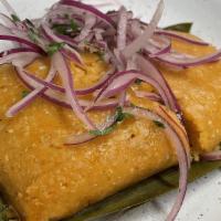 Tamal · Your choice of chicken or pork tamale, salsa criolla.