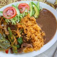 Carne Asada · Steak cooked with onions and jalapenos served with rice beans and tortillas