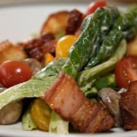 Wollensky Salad · Romaine lettuce, heirloom tomatoes, potato croutons, bacon lardons, marinated mushrooms, and...