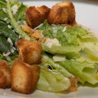 Caesar Salad · Romaine lettuce, traditional dressing, croutons, and parmesan frico.