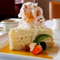 Coconut Layer Cake · Coconut sponge cake layered with whipped cream and malibu rum syrup, served with a crisp tui...