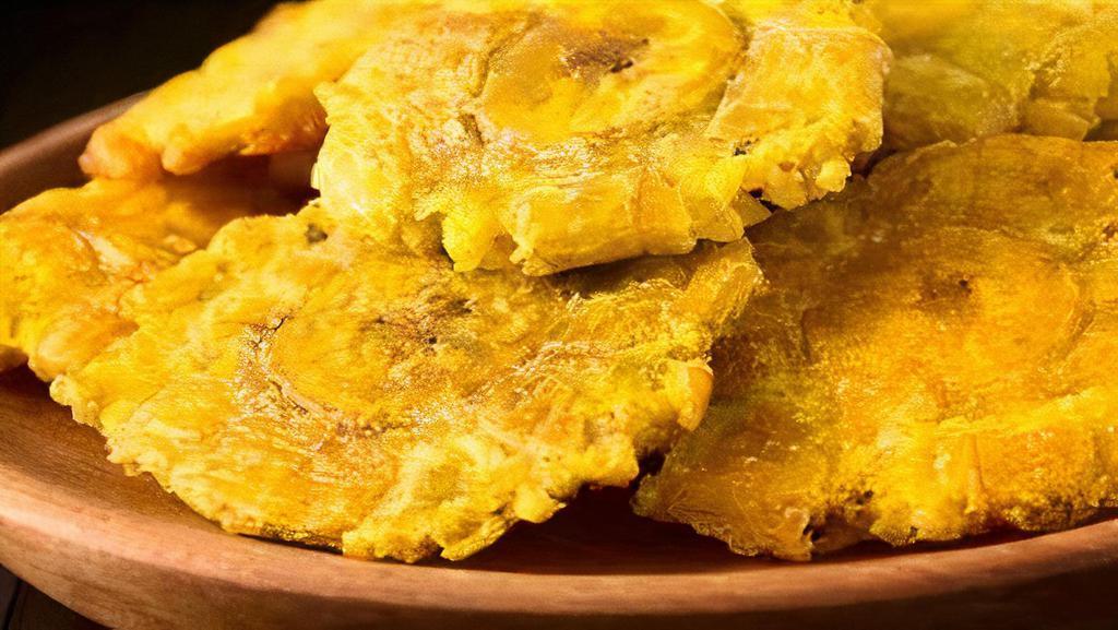 Tostones · Fried green plantain.