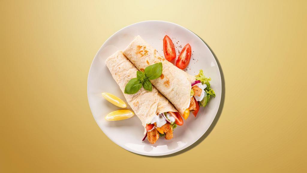 Chicken Shawarma Shredded · Home-made hummus, topped with finely spiced chicken topped with diced tomatoes, cucumbers, red and green peppers, pickles, and tahini sauce wrapped in a pita bread