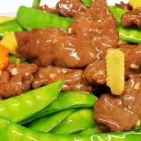 Beef With Snow Peas · Served with white rice.