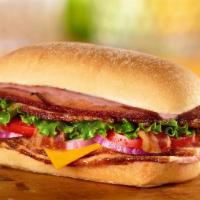 Bbq Smoked Stacker · Honey Baked Ham, bacon, cheddar cheese, lettuce, tomato, red onion and smoky BBQ sauce on ci...