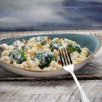 Chicken And Broccoli Pasta · Chicken and broccoli tossed with cavatappi pasta in an alfredo cream sauce, topped with parm...