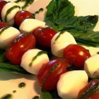 Caprese Salad · Tomato Cherry, Fresh Mozzarella, Pesto Sauce and Balsamic Reducction