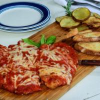 Chicken Parmigiana · Breaded chicken, san marzano tomato sauce, melted mozzarella with roasted potatoes.