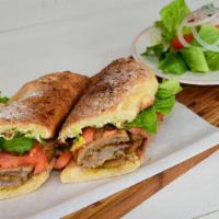 Milanesa · Beef lightly breaded, mayo, lettuce, and tomatoes.