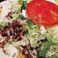 Nacho Supreme · Cheese nachos with assorted toppings of
beef and beans. All covered with lettuce,
tomatoes, ...