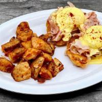 The Andrea Special · Fresh Baked Croissant sliced in half topped with Shaved Ham, Poached Eggs, and Hollandaise S...