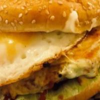 Del Tio Burger · Bread, crushed potato chips, meat, cheese, lettuce, grilled chopped onion, fried egg, and sa...