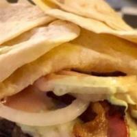 Del Primo Burger · Mix between wrap and burger. Tortilla, meat, cheese, bacon, lettuce, tomato, onion, and sauc...