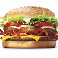 Triple Whopper® With Bacon & Cheese · Our Triple Whopper Sandwich with Bacon and Cheese includes three 1/4 lb* savory flame-grille...