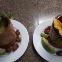 Mofongo Con Masitas De Puerco · Mashed green plantains with fried cubed pork/salad/tostones and maduros