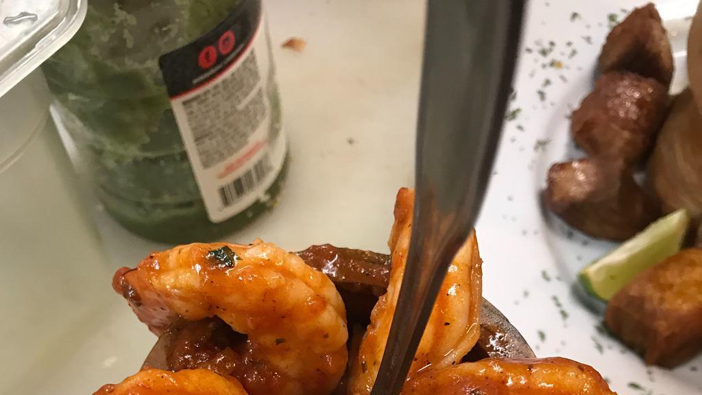 Shrimp Mofongo · Mashed green plantains with shrimp sauteed in safritos sauce/salad/tostones and maduros