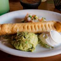 Flautas De Pollo · Two giant fried tortillas stuffed with your choice of shredded chicken or shredded beef. Ser...