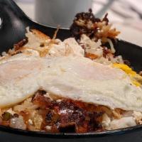 The Diner Skillet · Hash browns, onions, green pepper, mushrooms, bacon or sausage, and cheddar cheese.