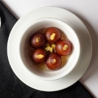 Gulab Jamun · Dumplings of fresh condensed milk solids are deep fried and soaked in sugar syrup and flavor...