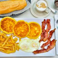 Tamiami Pancake · Served with Bacon or Ham, French fries, Cuban toast and 3 pancakes. Servido con Bacon o Jamo...