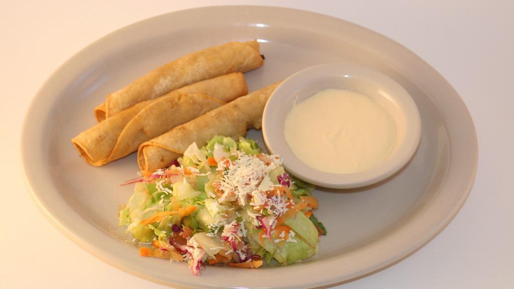 Tacos Fritos De Carne O Pollo · Fried chicken or beef tacos. Served with salad and sour cream.
