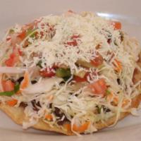 Enchilada De Camarones · Shrimp enchilada. Fried tortilla, cabbage, beans, cheese and pico de gallo.
