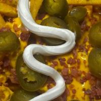 Loaded Cheese Fries · Loaded cheese fries With bacon nacho cheese jalapeño peppers sour cream