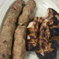 Seekh Kabab · Finely minced meat with aromatic herbs and special spices wrapped around a skewer and cooked...