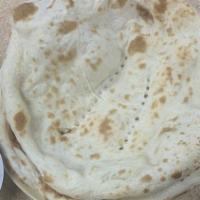 Paratha · Whole wheat multi layered bread cooked on a flat grill.