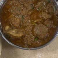 Karahi Gosht · Goat meat freshly cooked with tomatoes & spices.