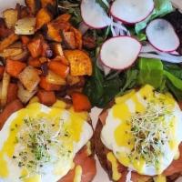 Salmon Benedict · An open-faced english muffin topped with our signature cilantro sauce, smoked salmon, poache...