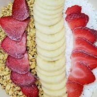 Acai Bowl · Blended acai, banana & strawberries topped with coconut flakes, banana & strawberries.