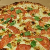 Tomato Basil Pizza (Medium 12'') · No red sauce, just extra virgin olive oil, garlic, mozzarella cheese, sliced tomato, fresh b...