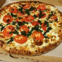 White Pizza (Medium 12'') · No red sauce. Prepared with sliced tomatoes, garlic, spinach, ricotta cheese, mozzarella che...