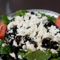 Greek Salad · Lettuce, tomatoes, onions, green peppers, black olives, feta cheese. Caesar dressing.