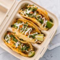 Jerk Chicken Tacos · Jerk seasoned shredded chicken.

Topped with your choice of shredded cheese, onions, cilantr...