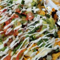 Vegan Nachos · Yellow Corn Tortilla Chips topped with a blend of Savory Portobello Mushrooms, Sweet Peppers...