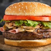Continental Burger · Onion sauce, lettuce, tomato, ham, mushrooms, grilled onions, and bacon.