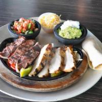 Fajitas · Grilled chicken, steak or both served on a sizzling platter over sauteed onions, and peppers...