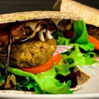 Raw Is Law Bbq Bacon Burger (2) · Sprouted spelt, or flax bread, eggplant bacon, lettuce, tomato, onions, herb burger, homemad...