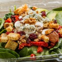 Walnut Spinach Salad · Baby spinach, walnut pieces, crumbled bleu cheese, avocado, sundried tomatoes, mushrooms, dr...